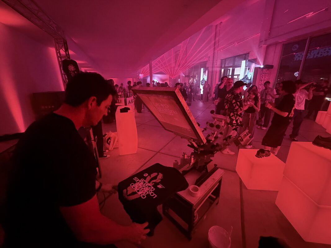 UV DTF station decorating hard goods next to the apparel press